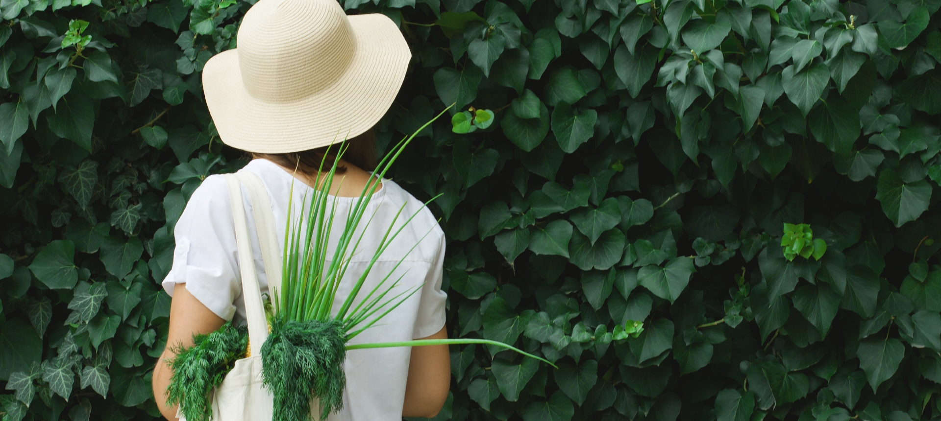 Girl with an eco bag on a juicy green background.