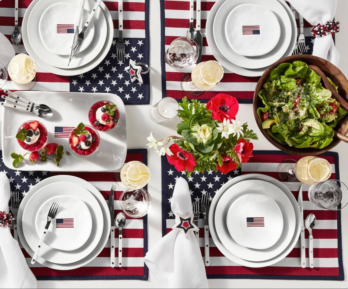 fourth of july themed table cloth, plates and cutlery, American flags