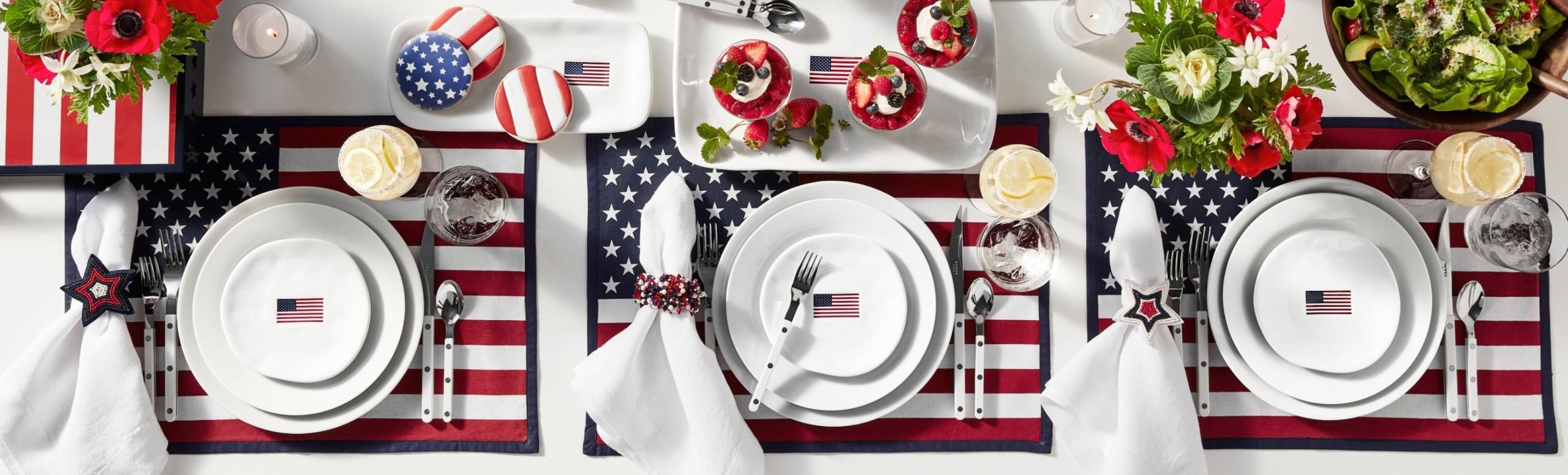 fourth of july themed table cloth, plates and cutlery, American flags