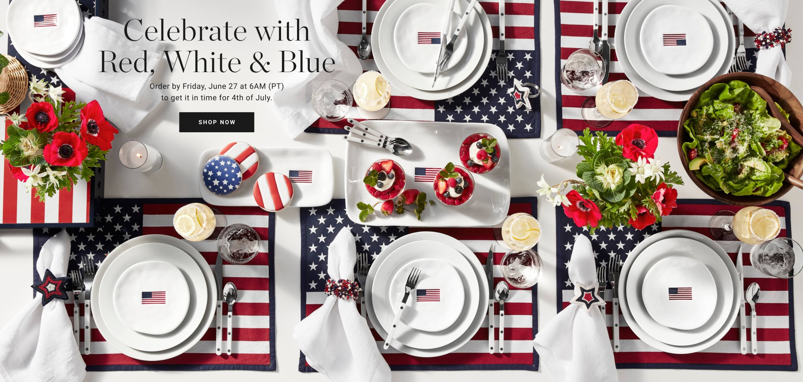 fourth of july themed table cloth, plates and cutlery, American flags