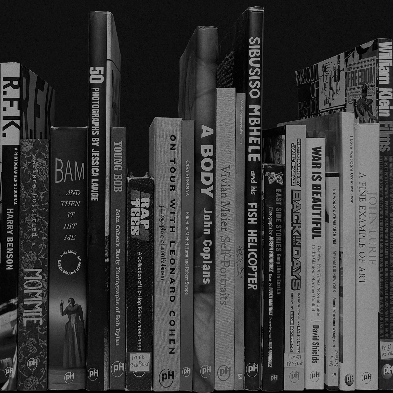 Black and white photo of books arranged on a shelf