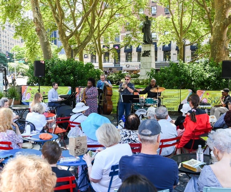 Jazz band playing live at Dante Park for a full audience