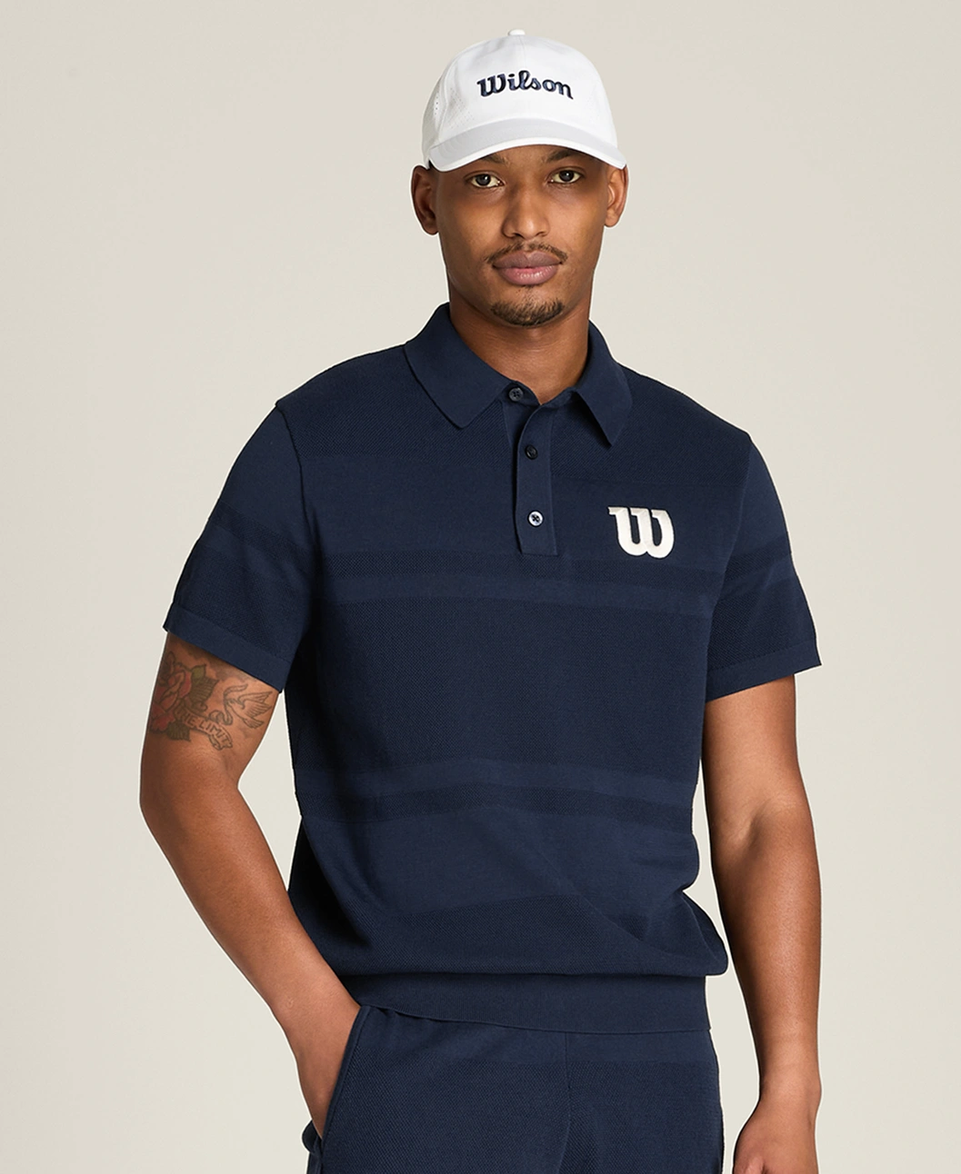 Wilson branded navy blue polo with horizontal stripes