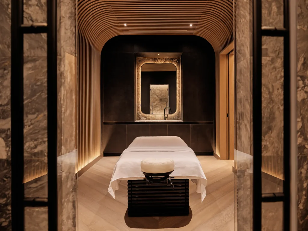 Equinox Hotel Spa with warm ambient light, white linens